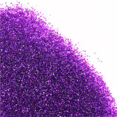 Kasvan purple sanding sugar on cupcakes for festive sparkle.
