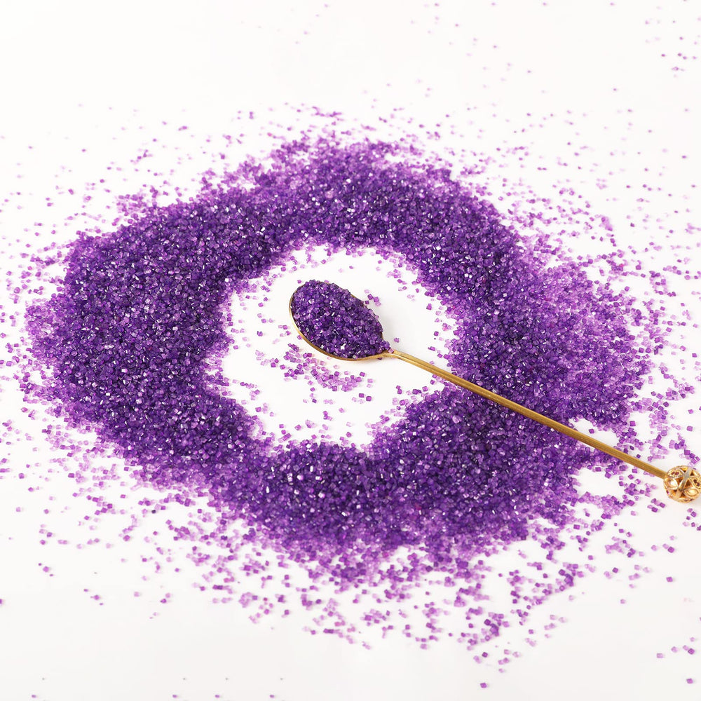Kasvan purple sanding sugar at a wedding dessert display.