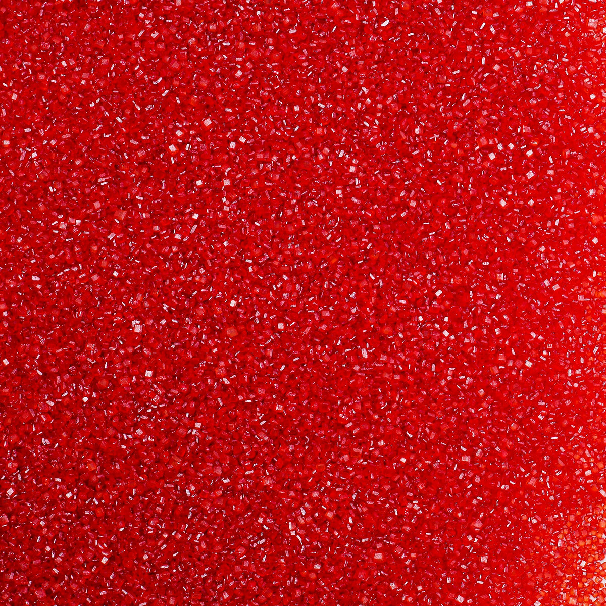 Kasvan Red Sanding Sugar jar front displaying vibrant edible crystals for cake decorating.