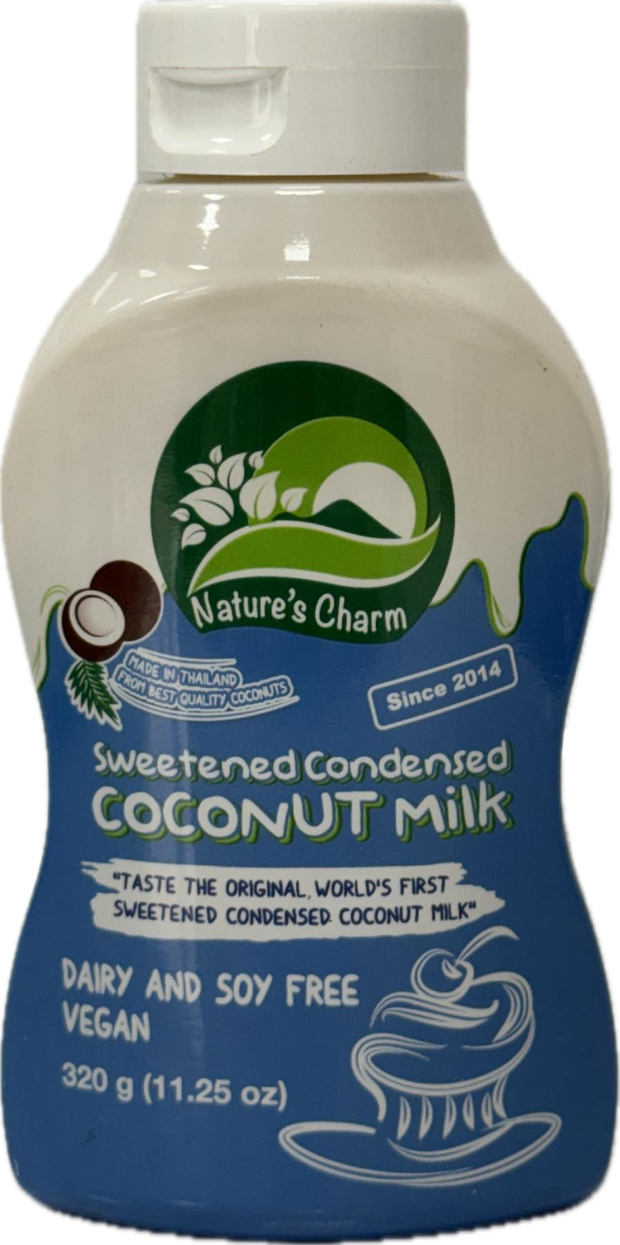 Nature's Charm condensed coconut milk being poured from the squeeze bottle.
