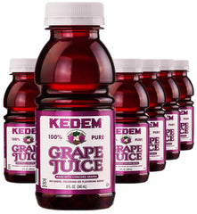 Kedem grape juice bottle label close-up with Concord grapes and kosher certification