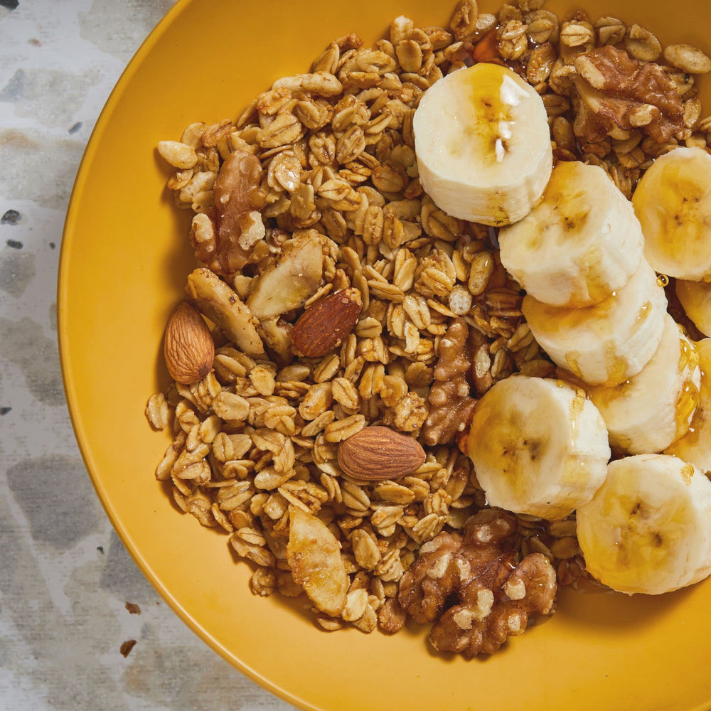 Kellogg's Bear Naked Banana Nut granola almonds and walnuts close-up, crunchy texture.