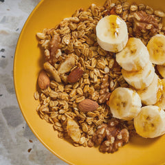 Kellogg's Bear Naked Banana Nut granola almonds and walnuts close-up, crunchy texture.