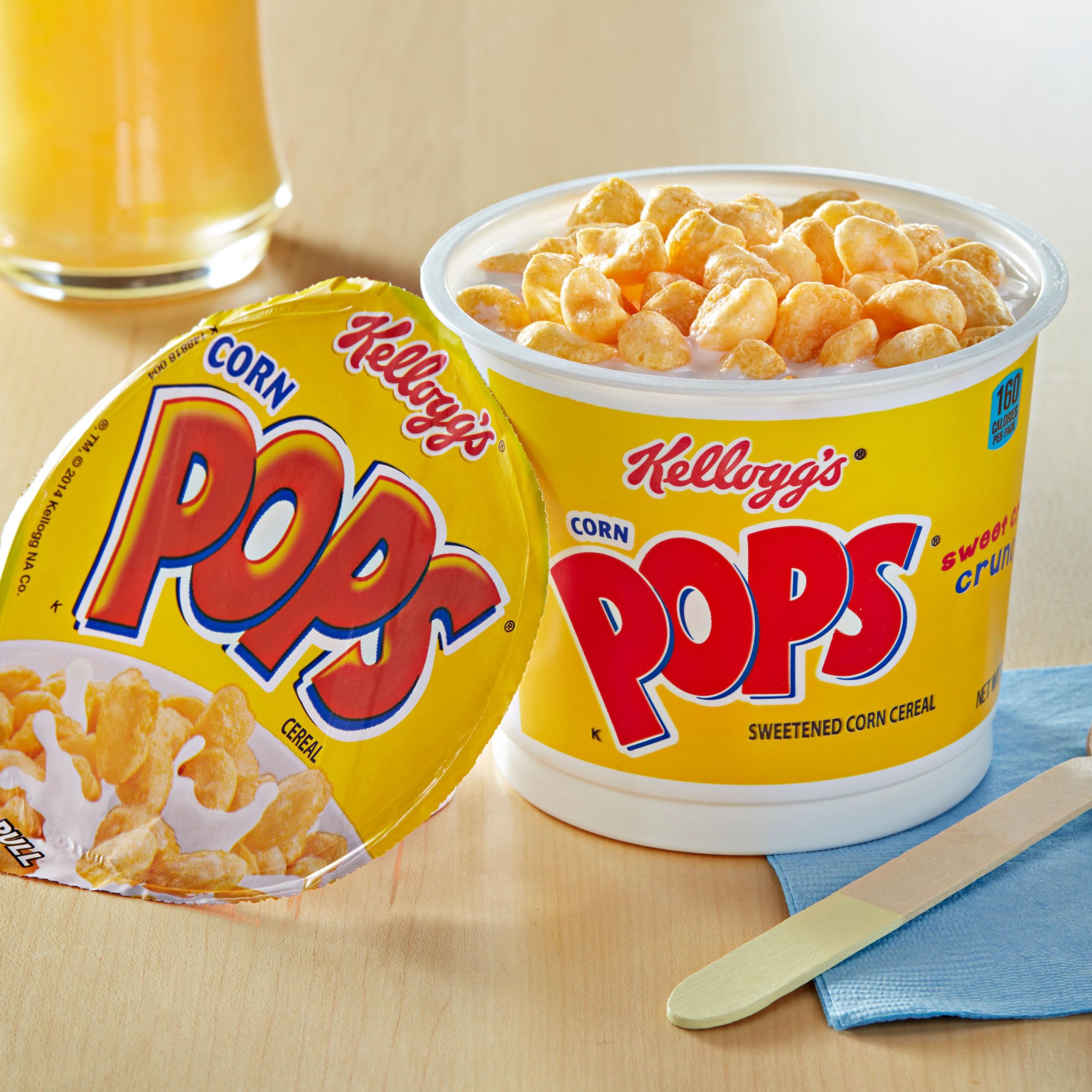 Kellogg's Corn Pops Cups spoon-ready serving showcasing crispy texture.