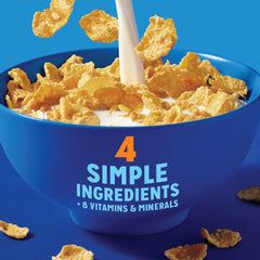 Milk poured over Kellogg's Frosted Flakes 25% Less Sugar for a creamy bite.