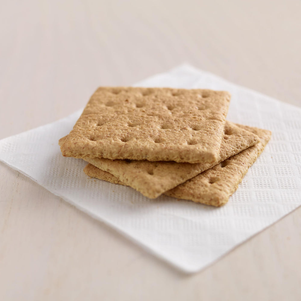 Kellogg's Honey Grahams crackers arranged on a serving tray for sharing.
