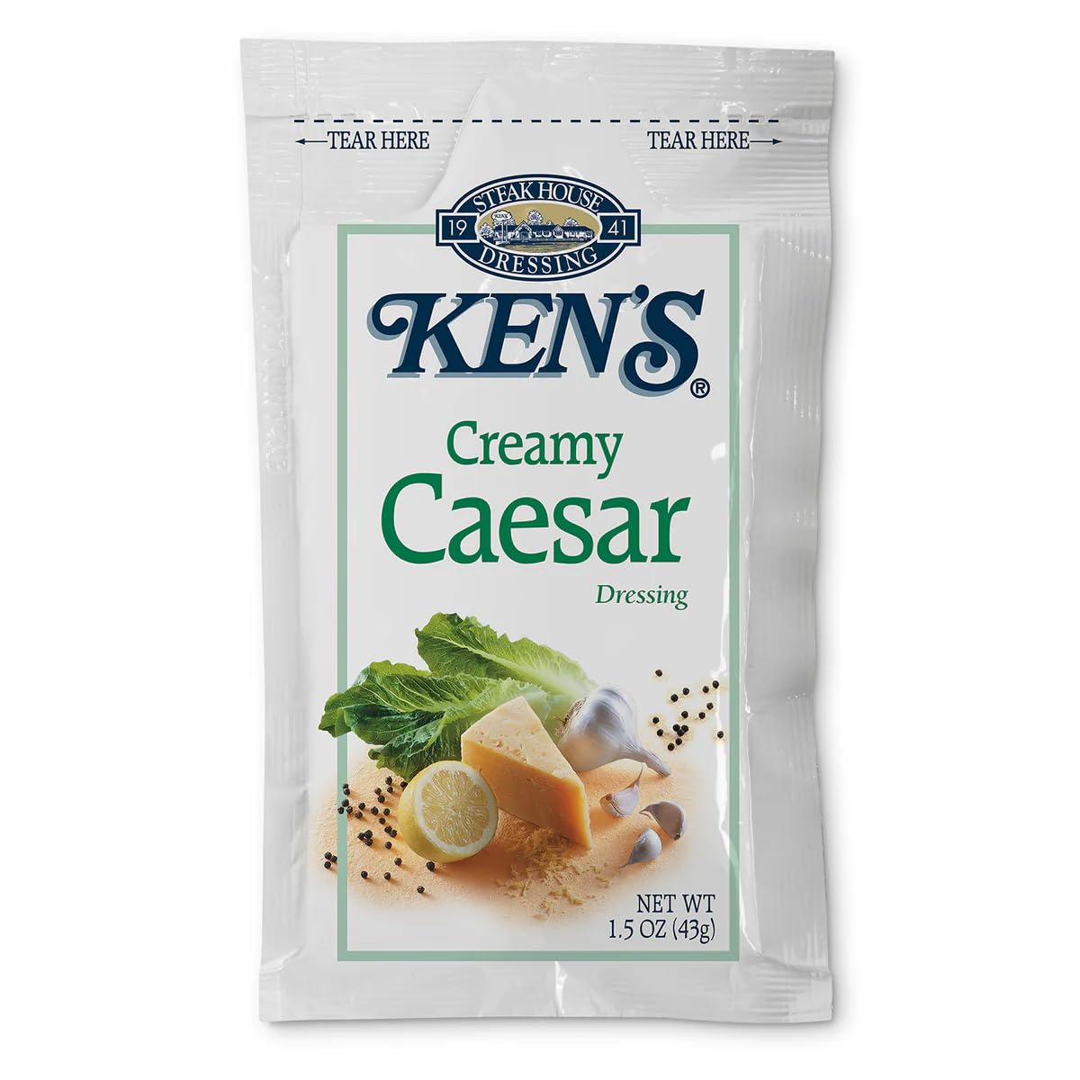 Ken's Caesar dressing on a side salad ready to serve.