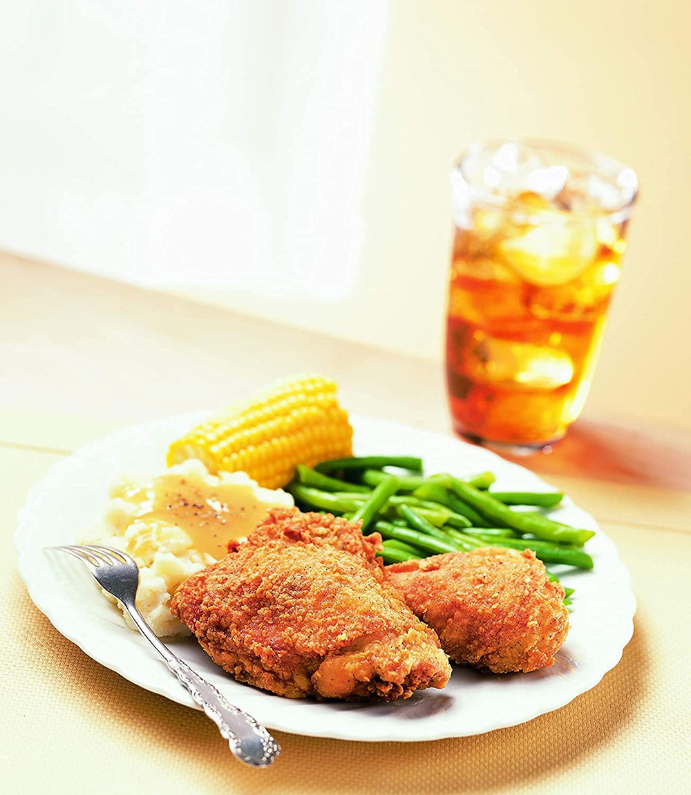 Kentucky Kernel seasoned flour coats chicken for a savory fry crust.