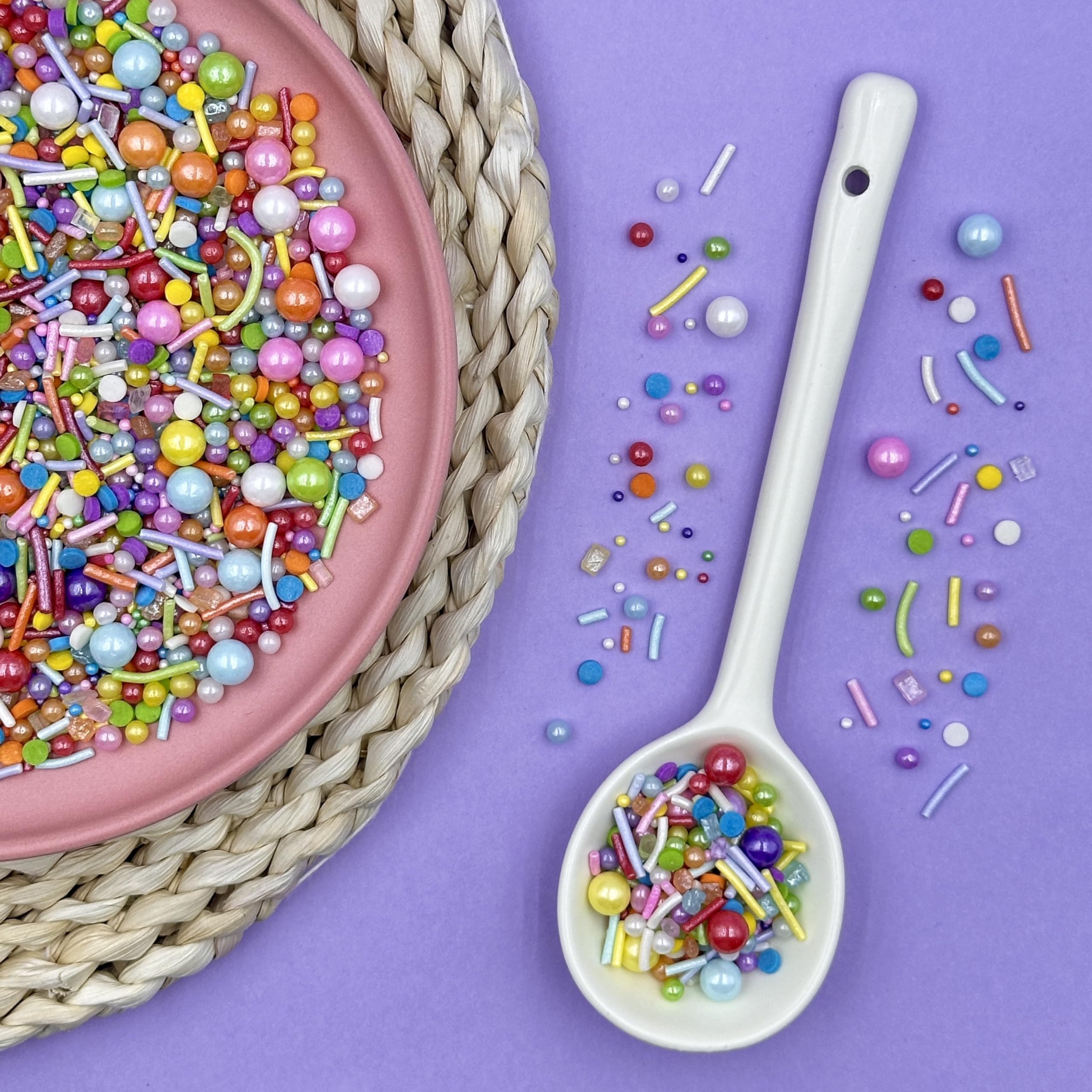 Kercky Rainbow Sprinkles on cake for colorful decoration.