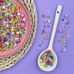 Kercky Rainbow Sprinkles on cake for colorful decoration.