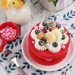 Kercky pink pearl sprinkles detail on cakes enhances celebration vibes.
