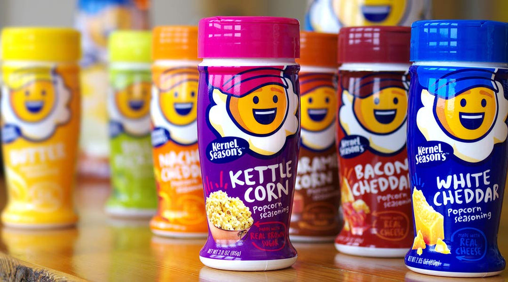 Kernel Season's Nacho Cheddar shaker beside a ready-to-serve bowl.