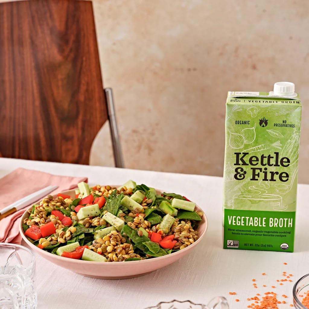 Kettle & Fire vegetable broth simmering in a bowl, aromatic base for meals.