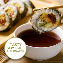 Kevala Coconut Aminos glass bottle demonstrates low-sodium seasoning for stir-fries.
