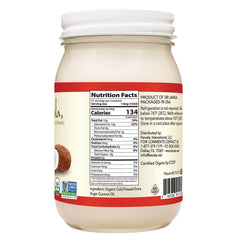 Pouring Kevala coconut oil, ideal for cooking and skincare routines.