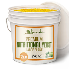 Kevala Nutritional Yeast Large Flake bottle pouring, ideal as a vegan cheese substitute