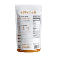 Kevin's Honey Garlic Sauce label close-up—non-GMO and preservative-free.