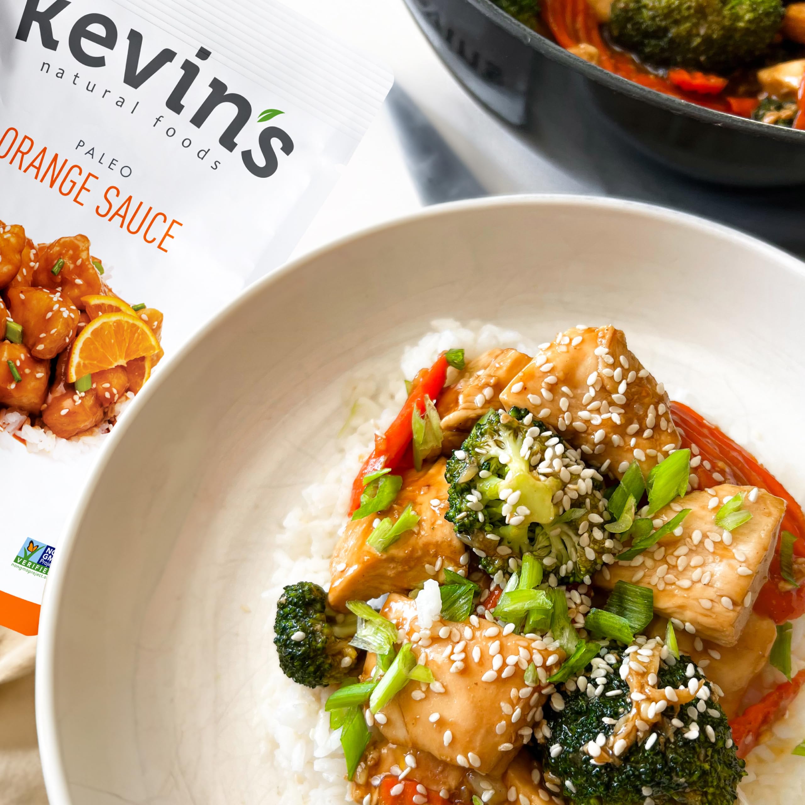 Kevin's Natural Foods orange sauce bottle pour for quick stir-fry meals