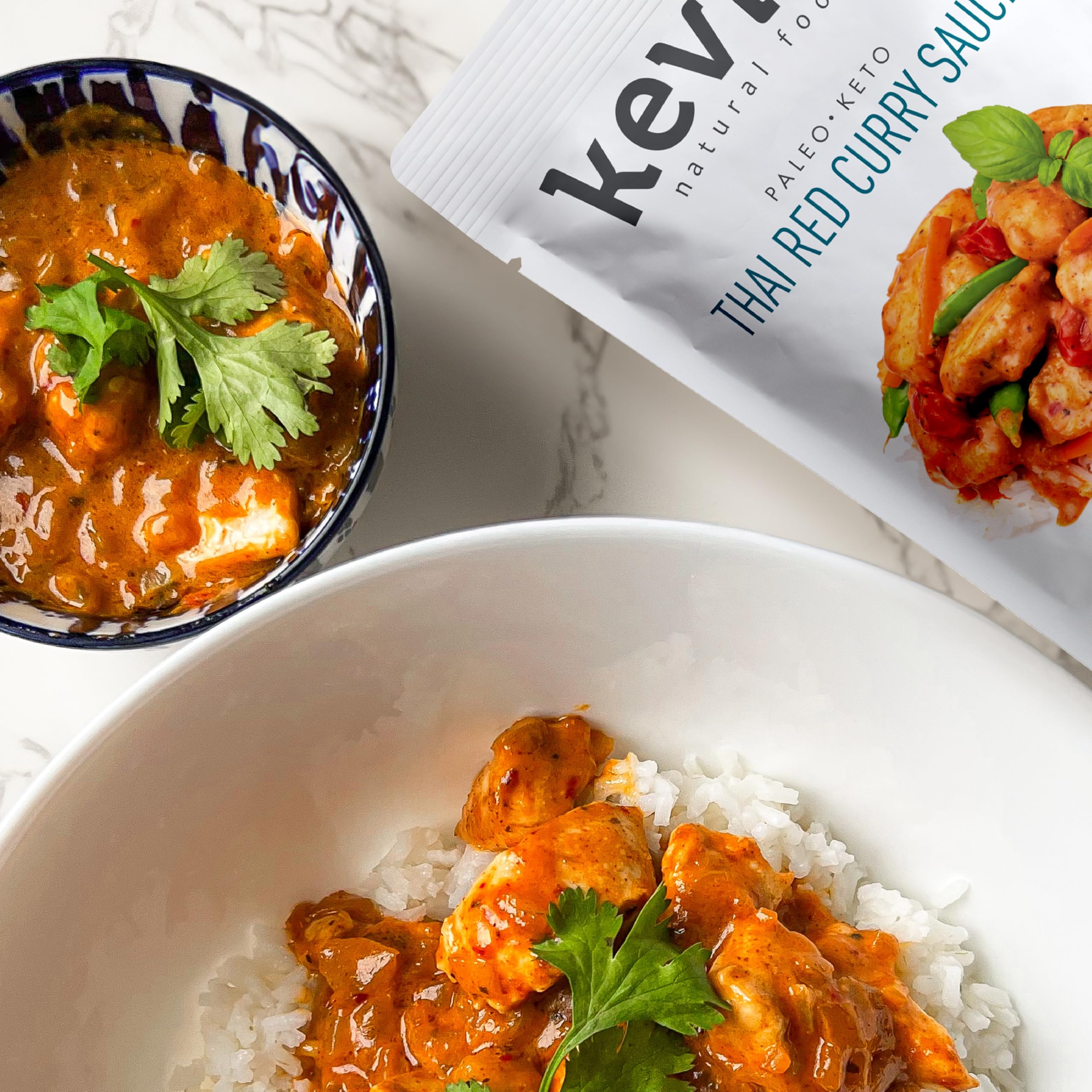 Kevin's Thai Red Curry Sauce ingredients close-up emphasize natural, non-GMO components.
