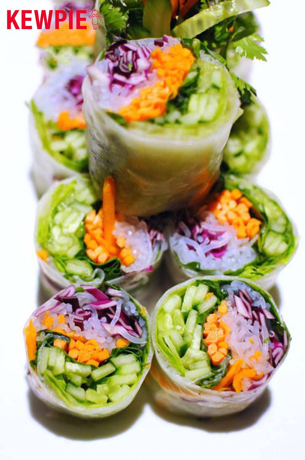 Salad bowl with creamy sesame dressing drizzled over greens.
