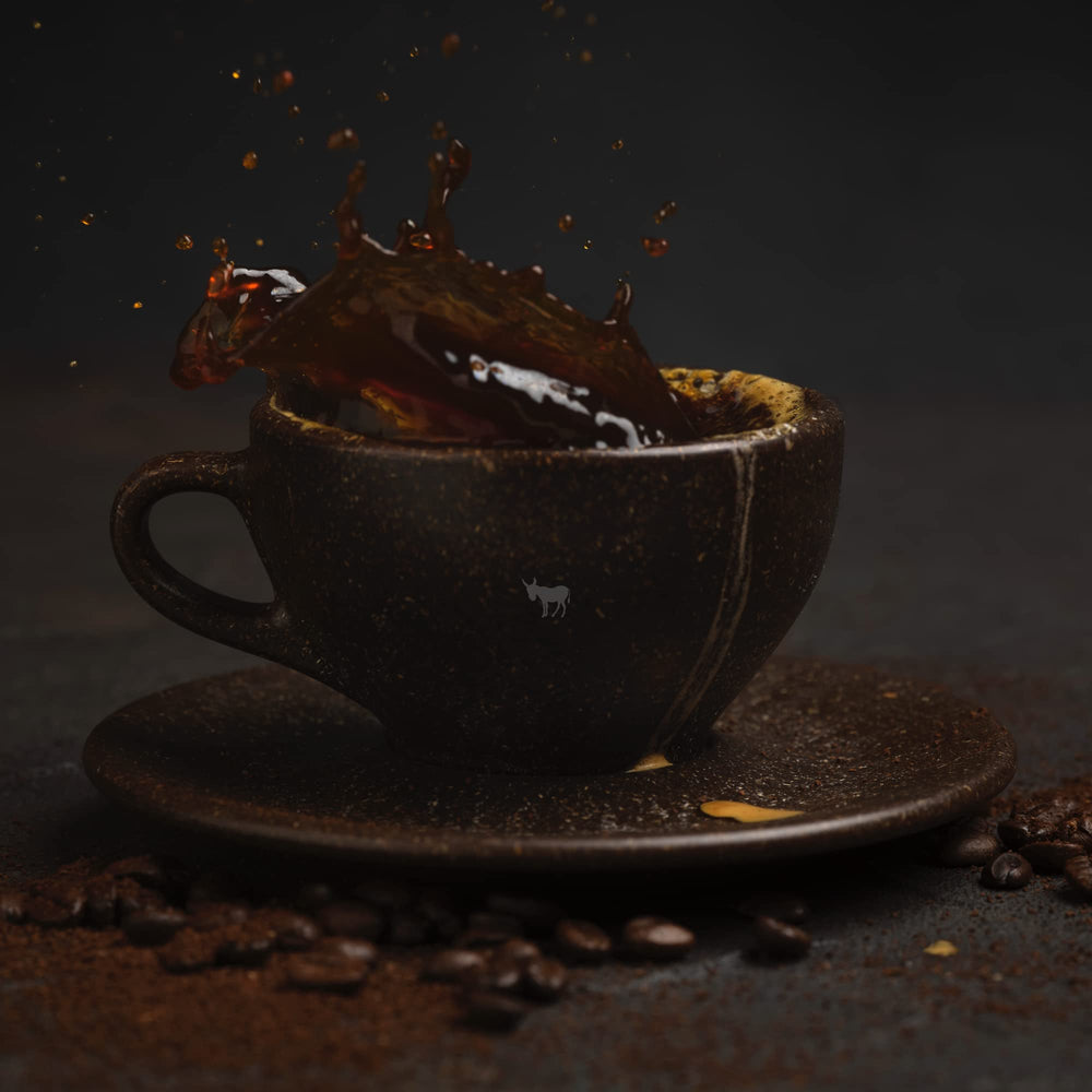 Kicking Horse Grizzly Claw roasted beans on a wooden surface