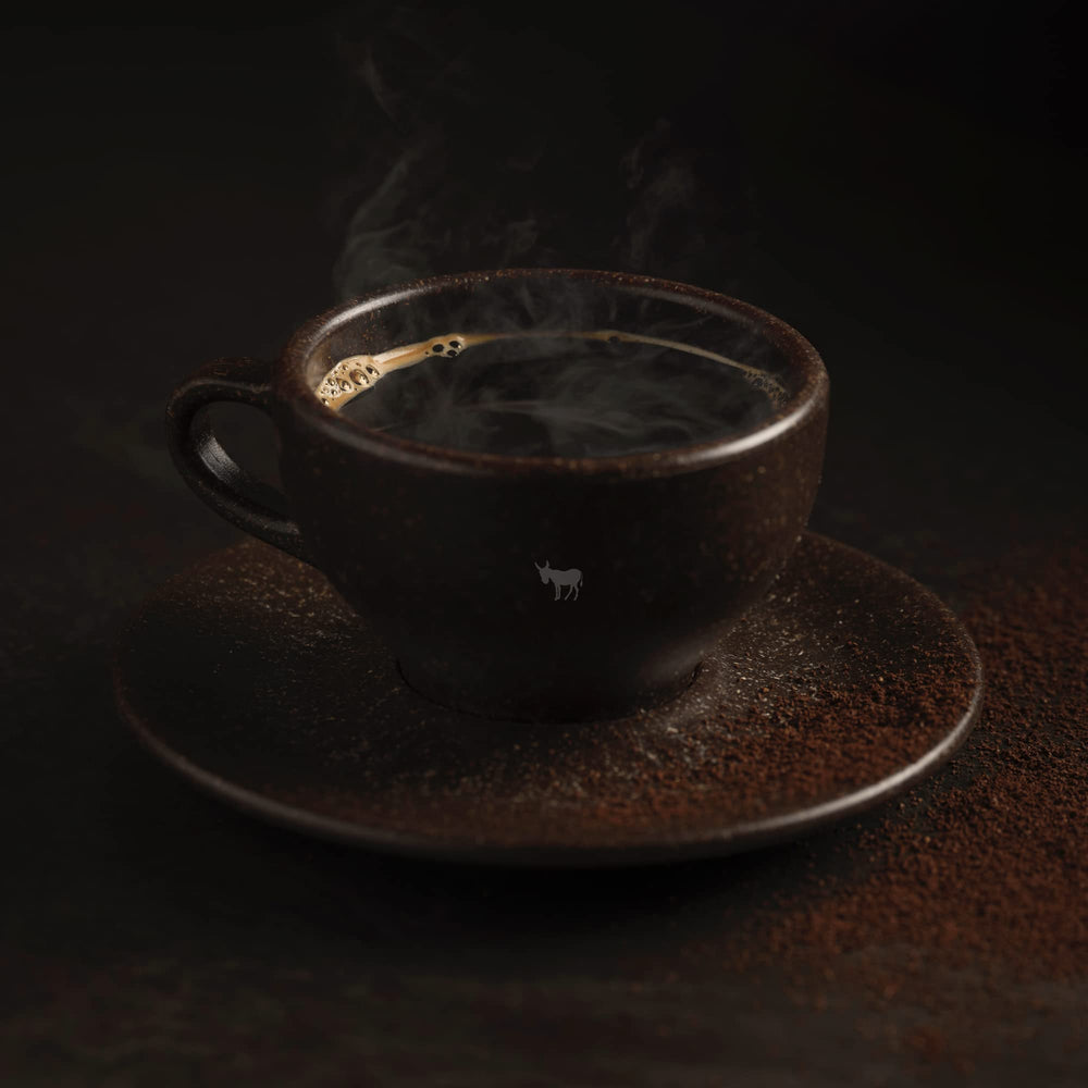 Kicking Horse Three Sisters aroma steam rising over a cup.
