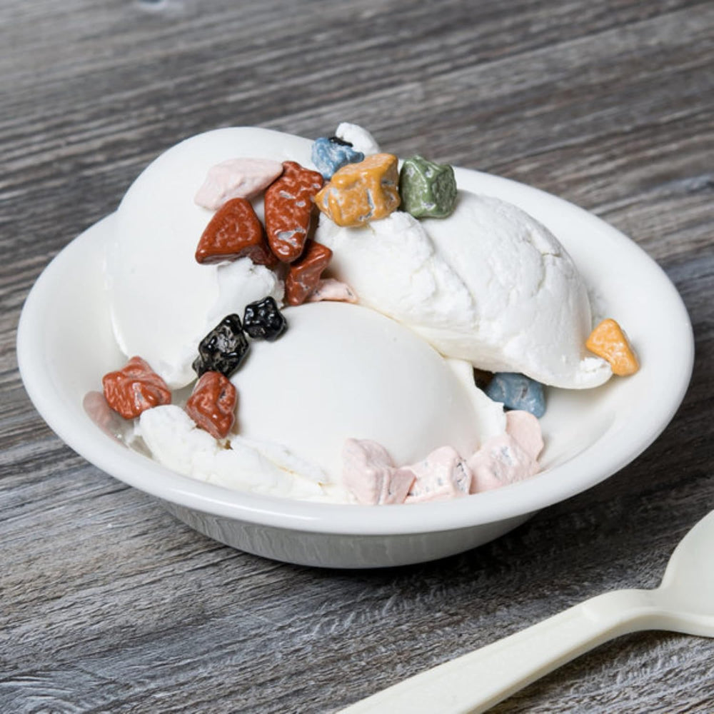 KIDU Chocolate Rocks bulk bag on cupcakes for a polished finish