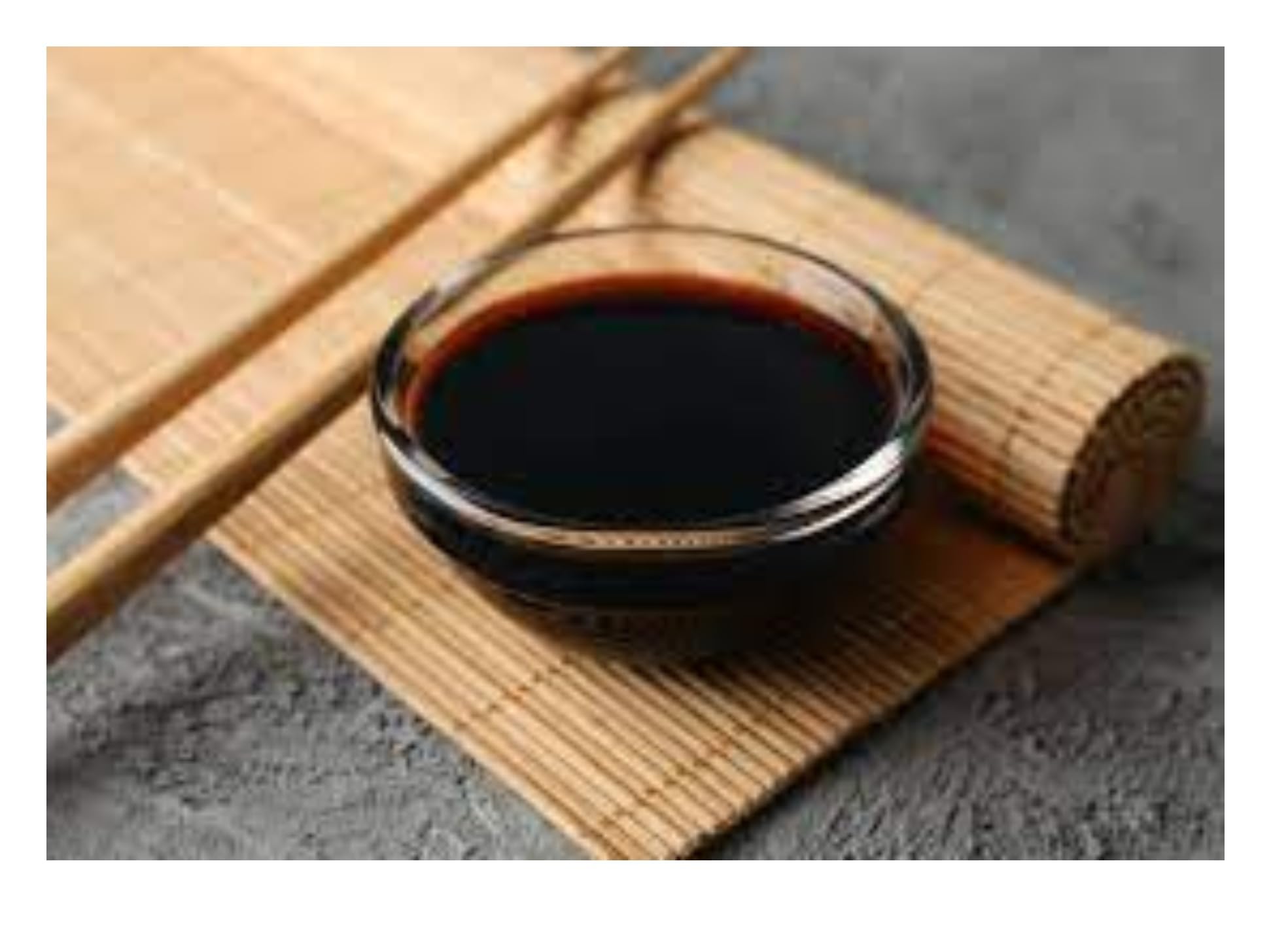 Kikkoman Less Sodium Soy Sauce bottle used with sushi and dips for authentic flavor