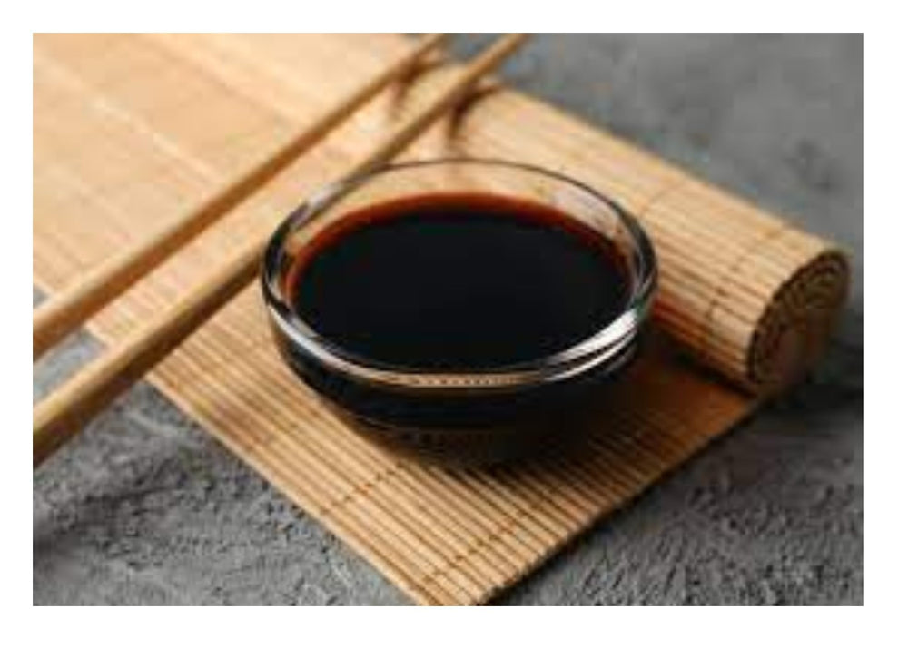 Kikkoman Less Sodium Soy Sauce bottle used with sushi and dips for authentic flavor