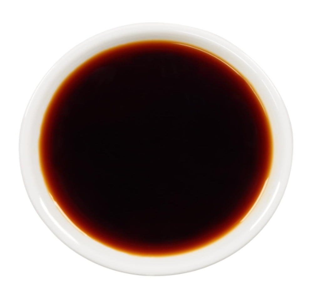 Kikkoman Less Sodium Soy Sauce on the kitchen counter ready for cooking