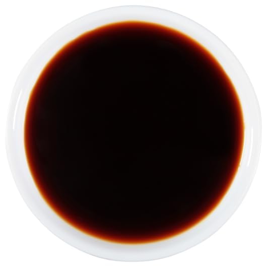 Pour spout in action allows precise dosing for stir fries.