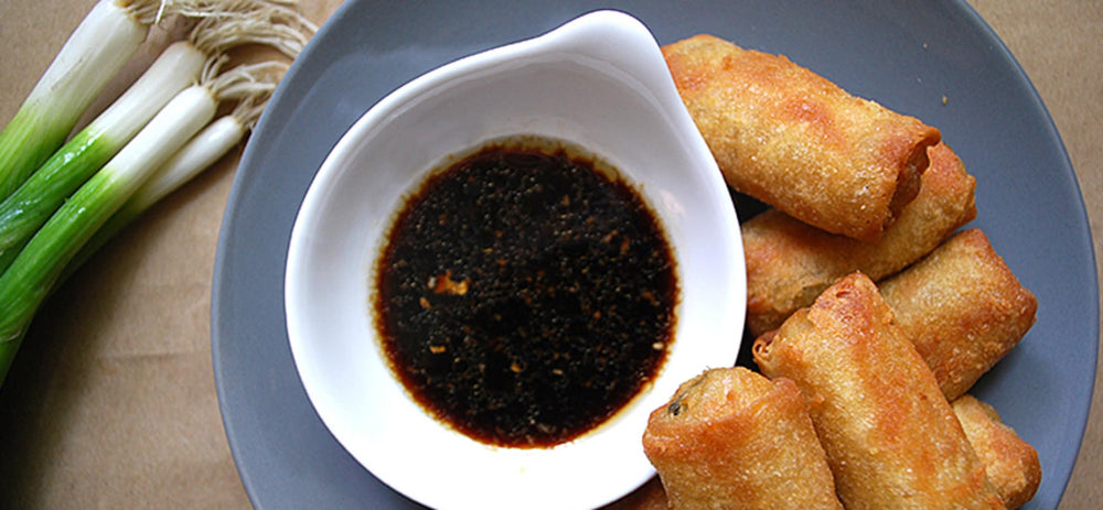 Kikkoman Lite Soy Sauce in a stir-fry pan adds savory depth