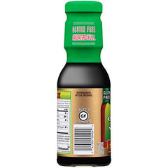 Kikkoman Oyster Sauce bottle with label visible, convenient size.