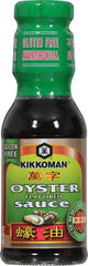 Kikkoman Oyster Sauce in a sizzling wok enhancing savory proteins.