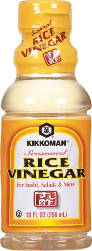 Kikkoman Seasoned Rice Vinegar on a salad, enhancing flavors with subtle sweetness.