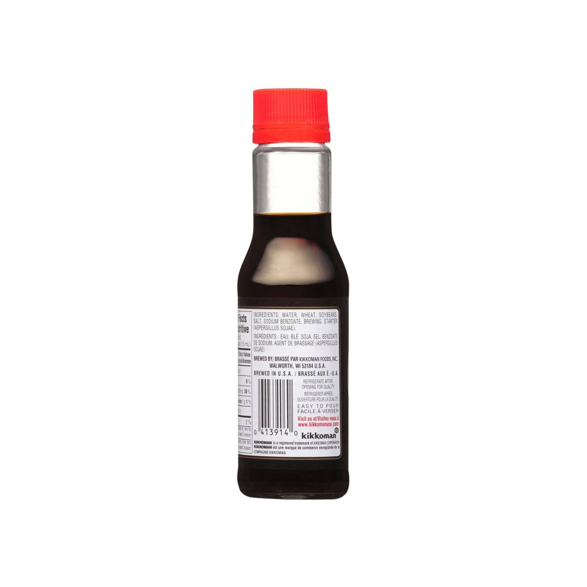 Kikkoman Soy Sauce bottle closeup highlights rich umami aroma.