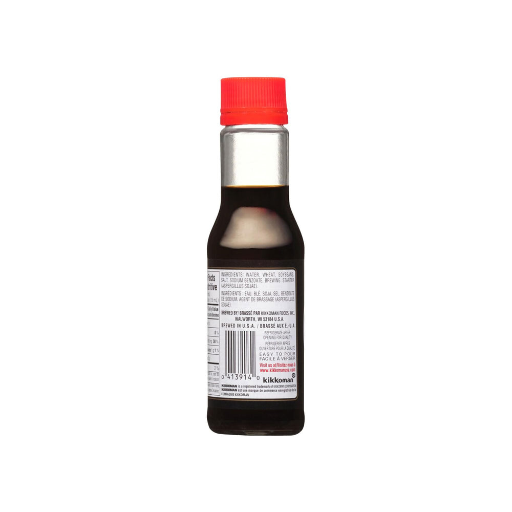 Kikkoman Soy Sauce bottle closeup highlights rich umami aroma.