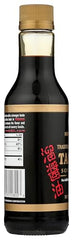 Kikkoman Tamari label close-up communicates naturally brewed, preservative-free quality.