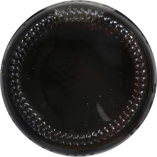Pour shot of teriyaki sauce streaming into a pan