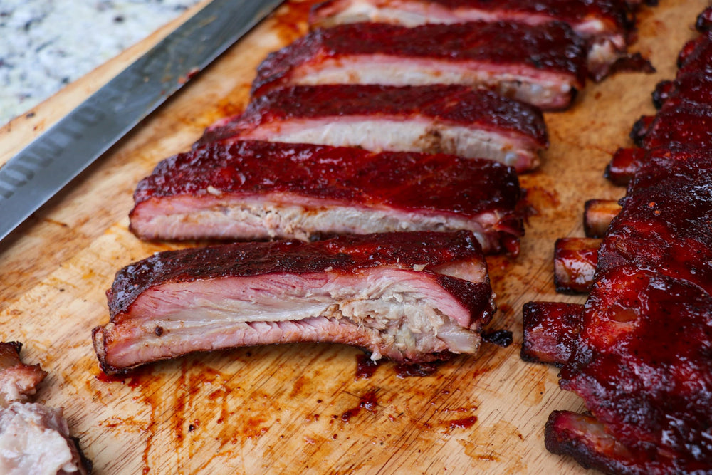 Killer Hogs AP seasoning in competition kitchen for championship-grade flavor.
