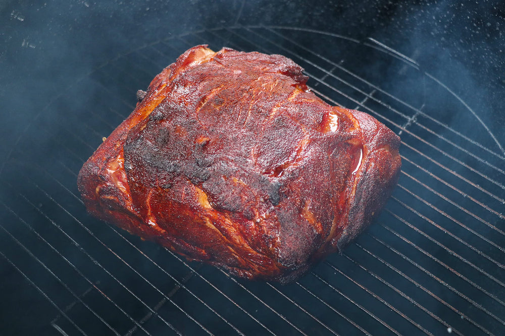 Killer Hogs BBQ Rub on the grill with sizzling meat