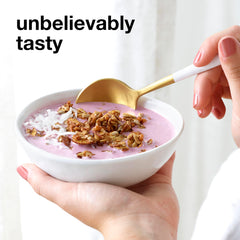 KIND granola topping on yogurt or smoothie bowl, a convenient breakfast option.