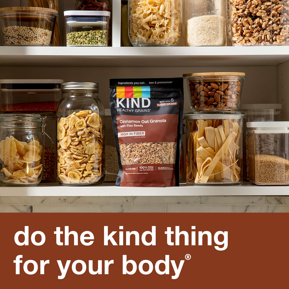 KIND Healthy Grains Cinnamon Oat Granola packaging on shelf signals gluten-free, Non-GMO snack