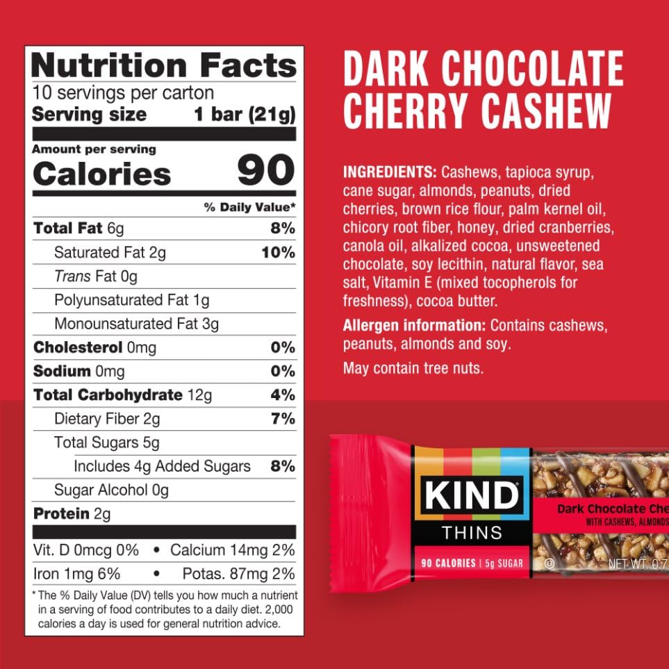 KIND THINS close-up of cashews under chocolate drizzle showing chewy, crunchy texture.