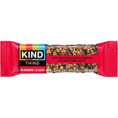 KIND Thins on-the-go snack in hand demonstrates portable, mess-free energy during activities.