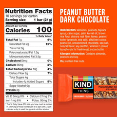 KIND THINS cashew-layer cross-section reveals crunchy cashews and chocolate coating.