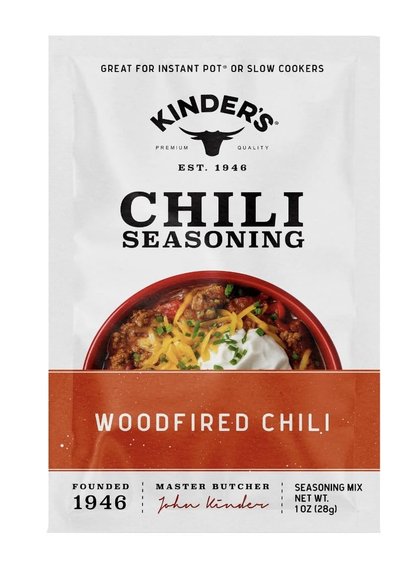 Pouring Kinder's Chili seasoning to boost flavor mid-recipe.