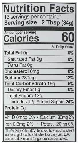 KINDER'S Organic Mild BBQ Sauce bottle glaze on grilled meat