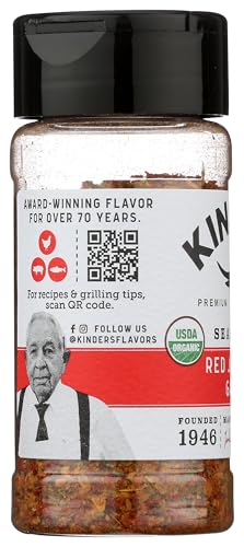 KINDER'S seasoning pour jar captured mid-pour for convenient seasoning.