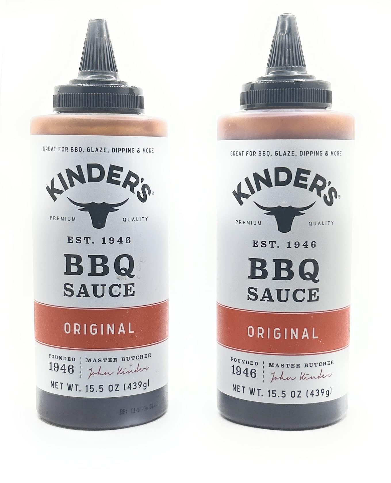 Kinder's Original BBQ marinade bottle on the grill, ideal for adding smoky glaze.